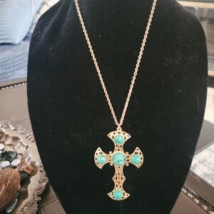 Large silver tone cross with faux turquoise pendant